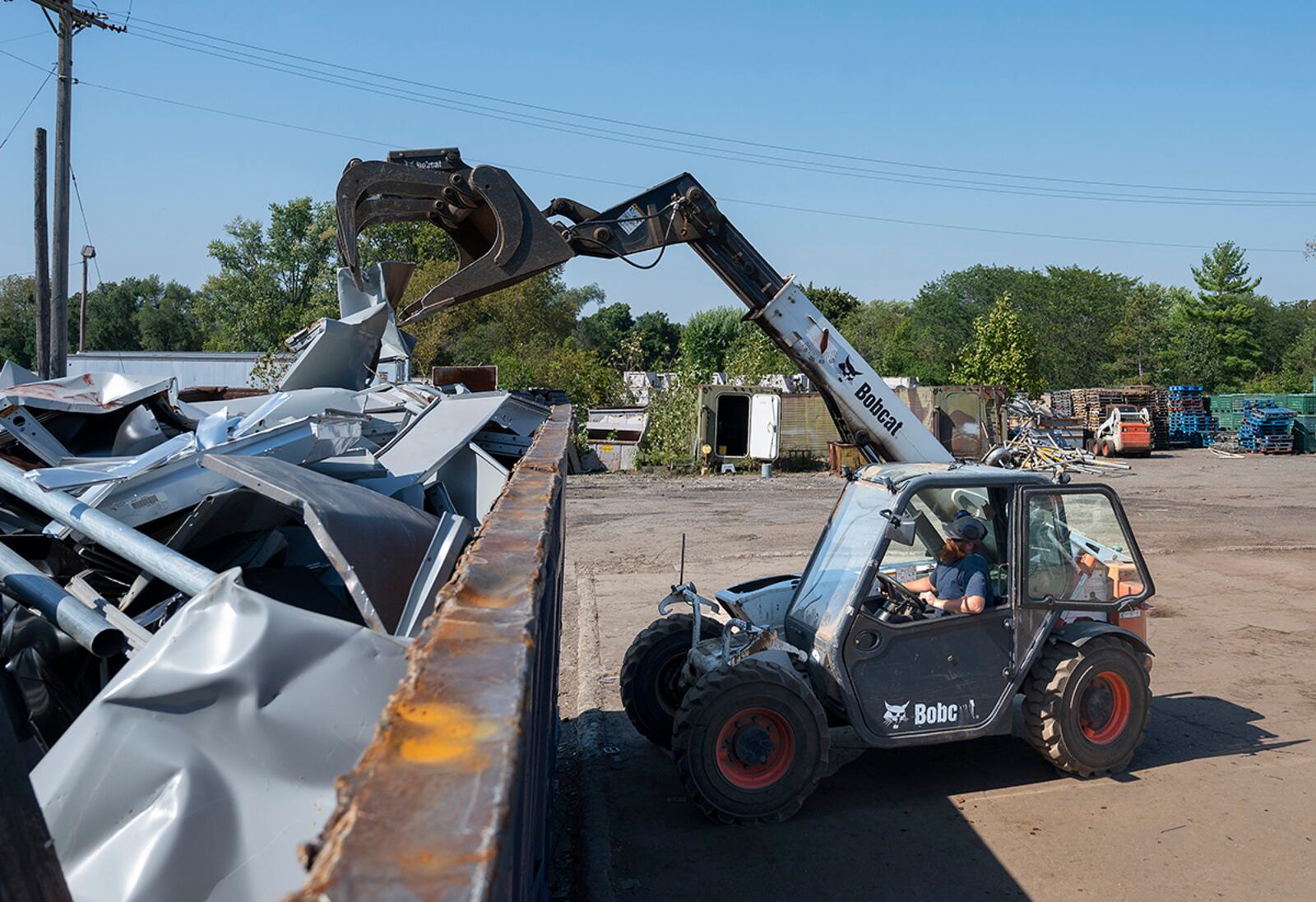 David Blair, 88th Force Support Squadron, loads steel into a large dumpster Sept. 27 in the Recycling Center’s metal yard at Wright-Patterson Air Force Base. In fiscal 2020, the center processed 2,500 tons of various metals. U.S. AIR FORCE PHOTO/R.J. ORIEZ