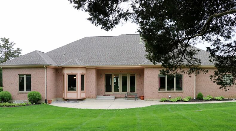 Double patio doors open off the great room to the concrete patio and semi-private back yard.