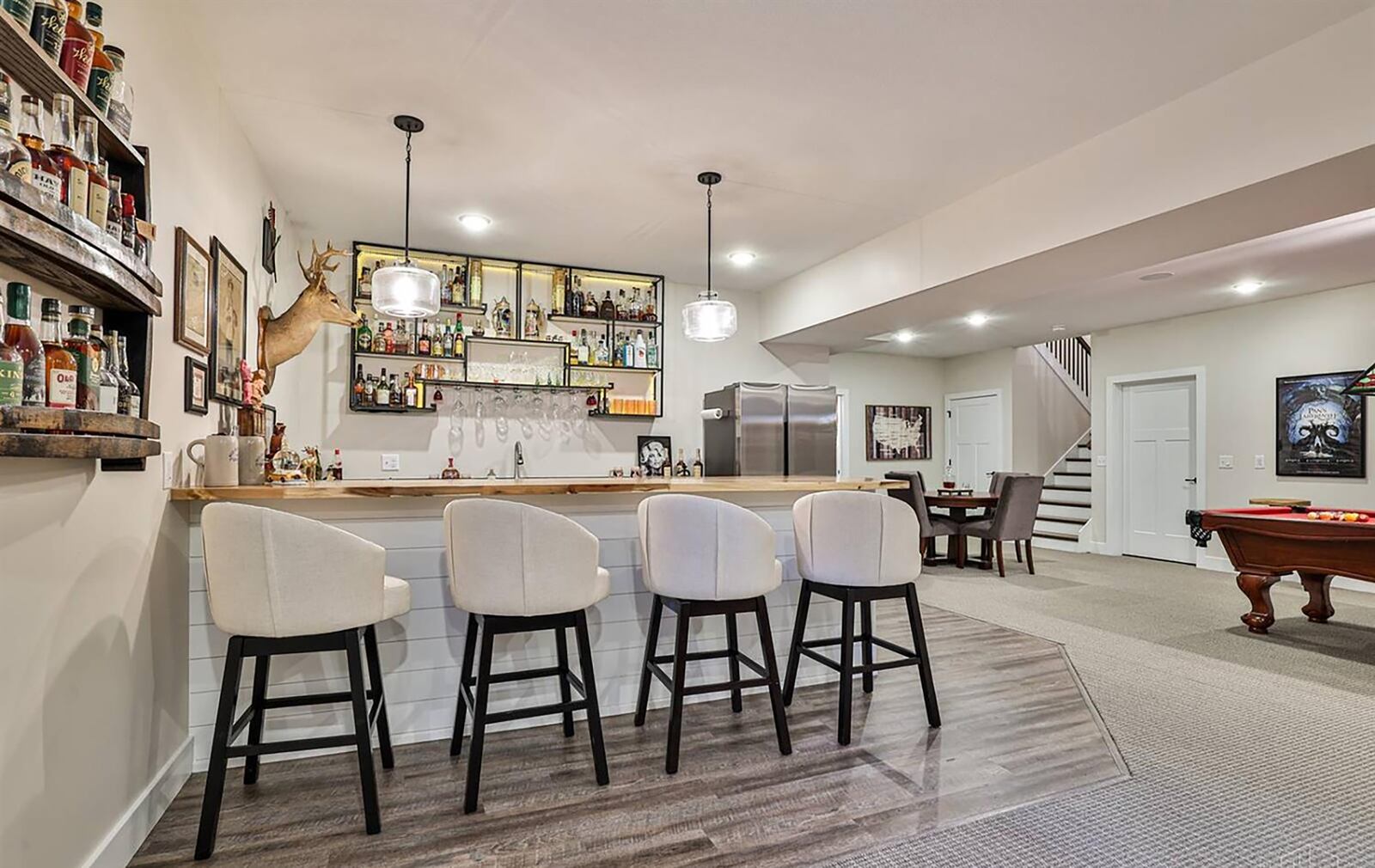 The finished basement has a family room and wet bar/kitchenette with bar area with seating. CONTRIBUTED