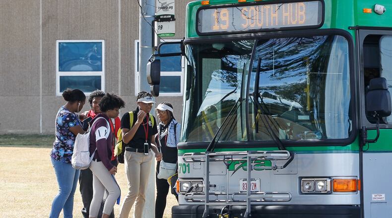 Dayton Public Schools reintroduced busing for high school students this fall, with a temporary system through September, then special “limited service” RTA routes since then. CHRIS STEWART / STAFF