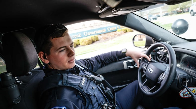 Beavercreek Police Officer Garrett Karolyi leaves the police station on Research Park Drive on Friday April 7, 2023. JIM NOELKER/STAFF