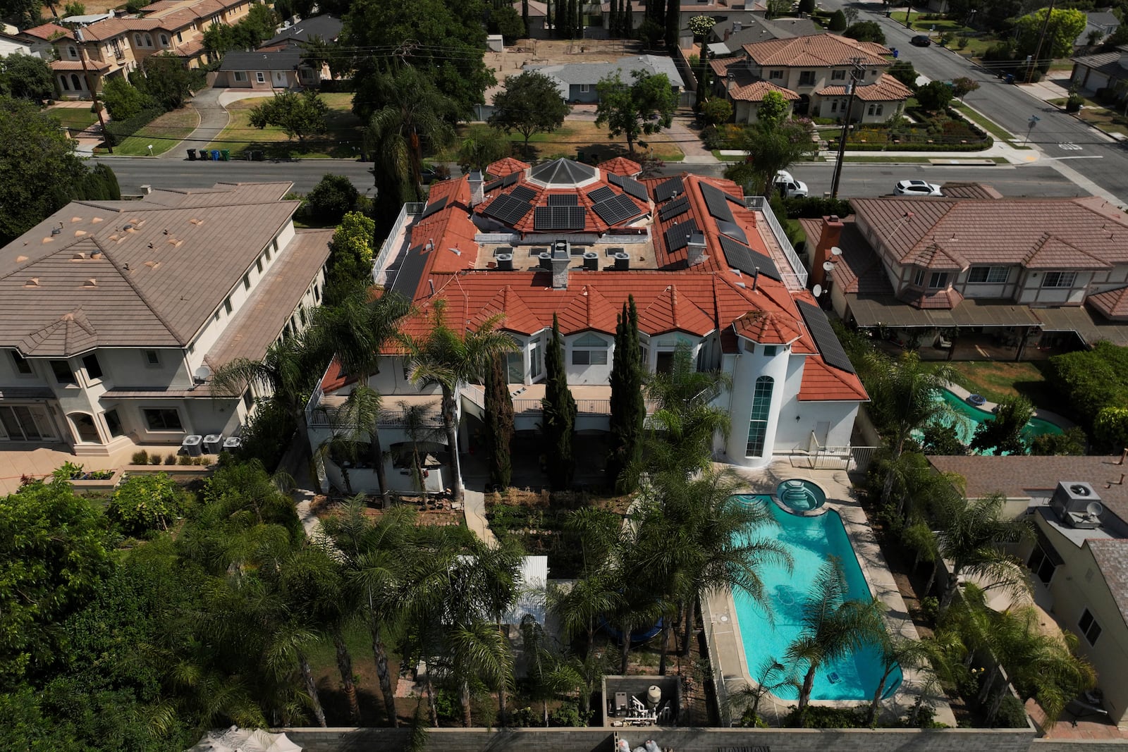 An aerial view shows the home of Silvia Zhang and Guojun Xuan on Wednesday, July 16, 2025, in Arcadia, Calif., where a number of children were removed from the couple's home after a child abuse allegation in May, according to Arcadia police. (AP Photo/Jae C. Hong)