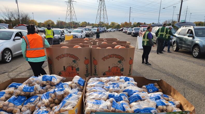 Foodbank volunteers are pictured loading food at a mass distribution center. Volunteers are always needed.
CONTRIBUTED