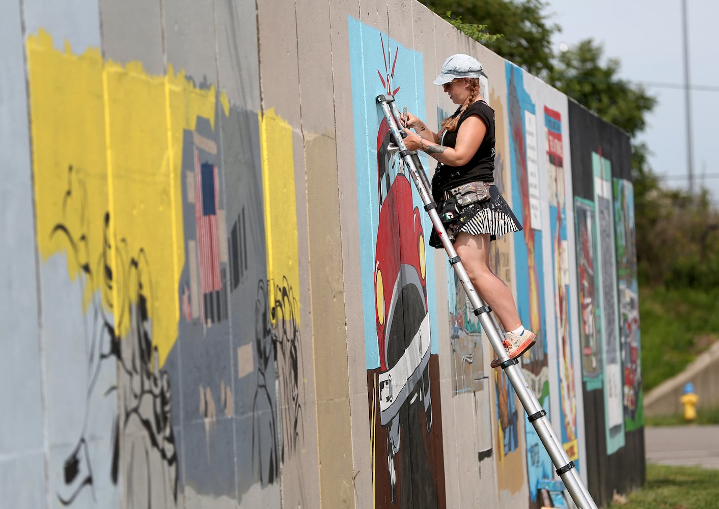 PHOTOS: Comic book style mural honors Dayton Fire Department history