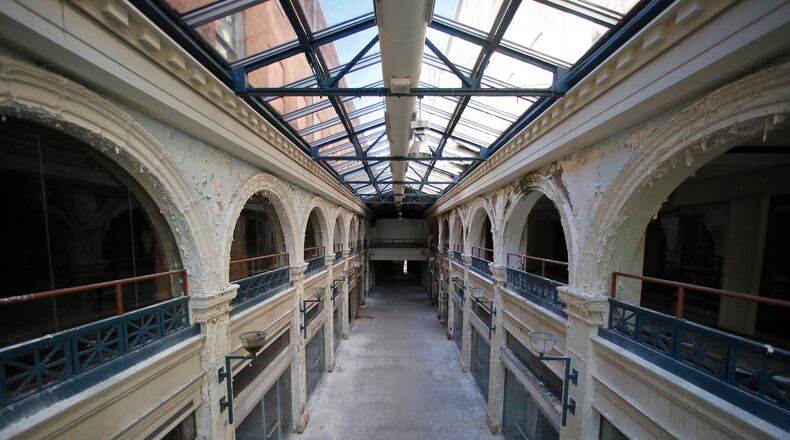 A two-story interior section of the Third Street Dayton Arcade. The city of Dayton Friday pulled a request for $1 million in Montgomery County ED/GE funding to redevelop the arcade — but another funding request is expected in the spring. TY GREENLEES / STAFF