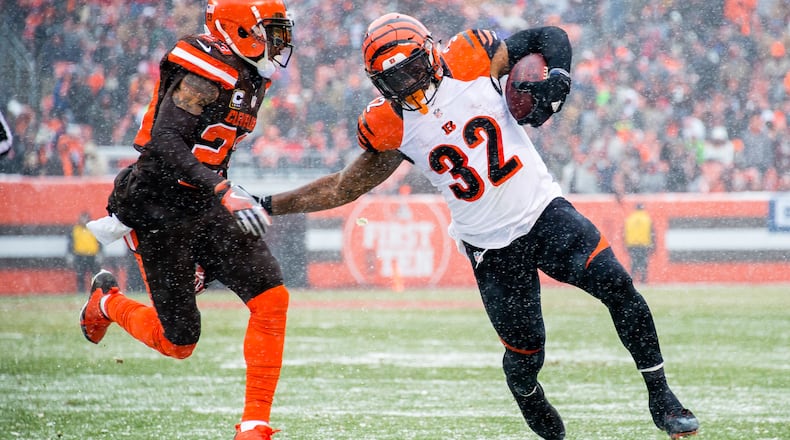 CLEVELAND, OH - DECEMBER 11: Running back Jeremy Hill #32 of the Cincinnati Bengals rushes against cornerback Joe Haden #23 of the Cleveland Browns during the first half at FirstEnergy Stadium on December 11, 2016 in Cleveland, Ohio. (Photo by Jason Miller/Getty Images)