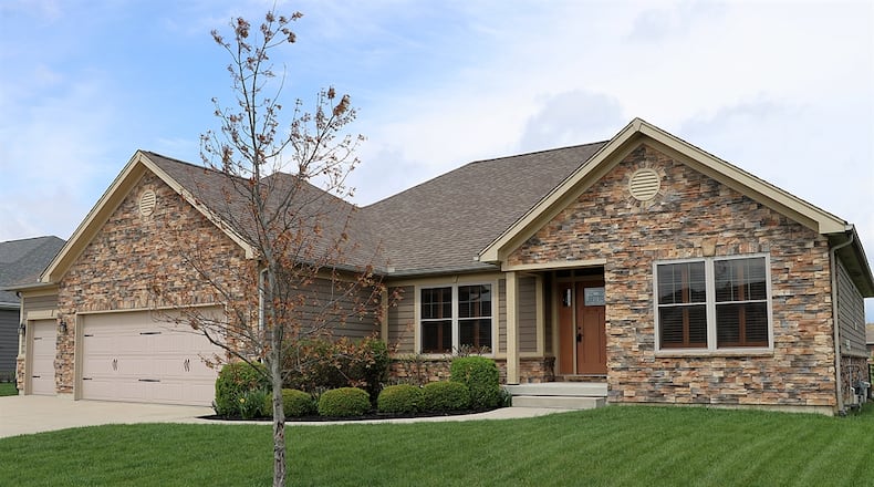 Located in Monroe Twp. and listed for $610,000, the stone-and-plank house at 1215 Daylily Way has about 3,298 square feet of living space. CONTRIBUTED PHOTOS/KATHY TYLER