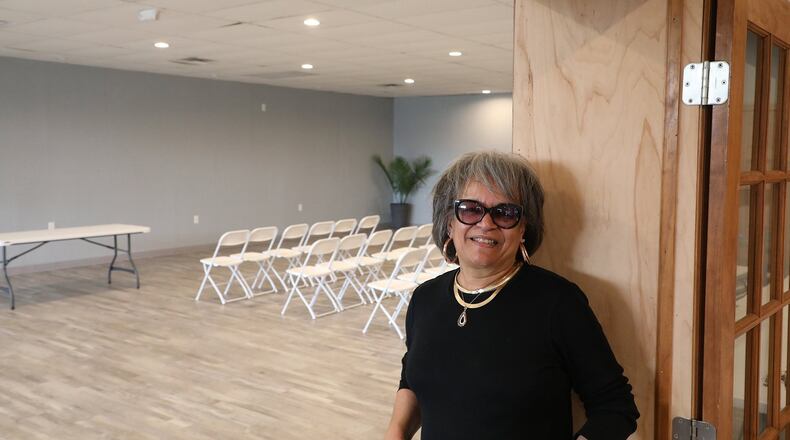 Sheila Lash Rice shows off one of the rooms in “The L”, a small banquet facility on South Yellow Springs Street. She will be discussing the past and present of that street during a Thursday night discussion at the Shouvlin Center at Wittenberg University. BILL LACKEY/STAFF