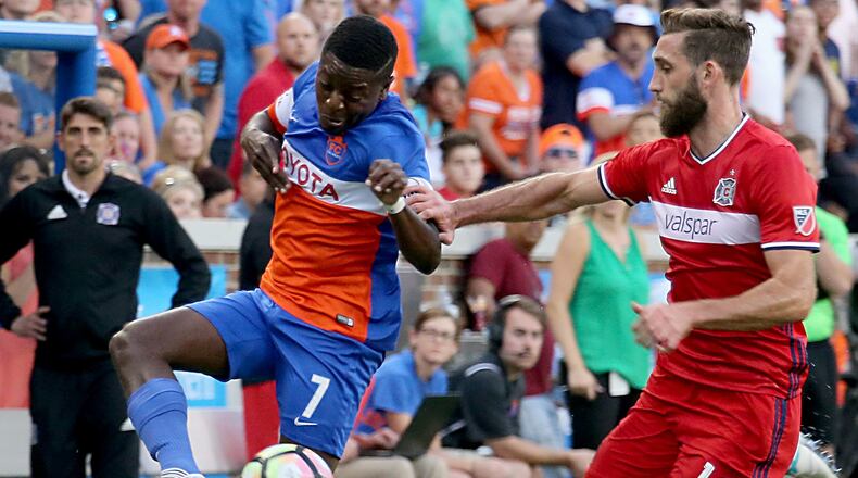 Contributed photo/WCPO FC Cincinnati forward Kadeem Dacres controls the ball while Chicago Fire’s Jonathan Campbell pressures during their U.S. Open Cup match at Nippert Stadium in Cincinnati Wednesday, June 28, 2017.