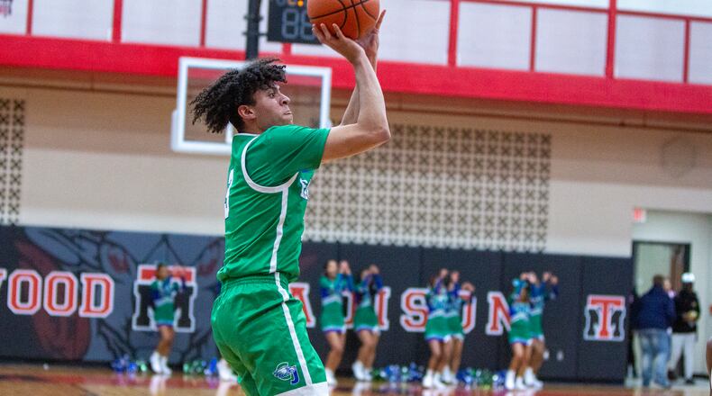Chaminade Julienne senior George Washington III shoots for two of his game-high 24 points in Saturday night's season opener at Trotwood-Madison. CONTRIBUTED/Jeff Gilbert