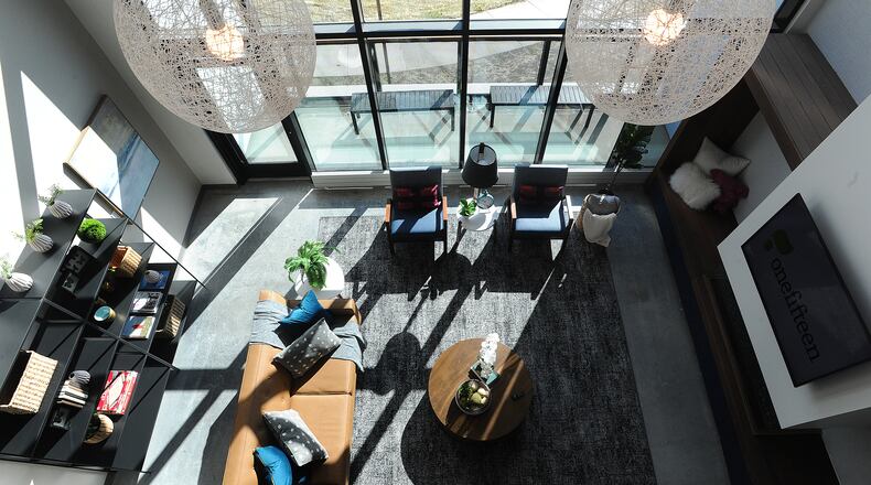 OneFifteen Living, an apartment complex that is part of the addiction treatment and recovery center OneFifteen, celebrated with a ribbon cutting on Friday. The new 26,300-square-foot building has 29 double-occupancy rooms with separate living spaces for men and women, group kitchens, a fitness center, meditation room, coffee bar and rooms for individual and group therapy. Outdoor space is still being developed. “OneFifteen Living will give people a safe place to live while they continue their journey of recovery,” said President and CEO Marti Taylor. MARSHALL GORBY\STAFF