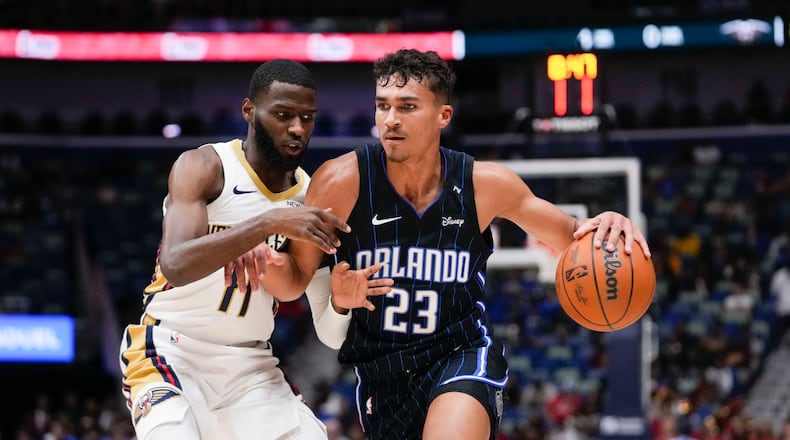 Orlando Magic forward Tristan da Silva (23) drives to the basket against New Orleans Pelicans guard Jalen Crutcher (11) in the second half of an NBA preseason basketball game in New Orleans, Monday, Oct. 7, 2024. The Pelicans won 106-104. (AP Photo/Gerald Herbert)