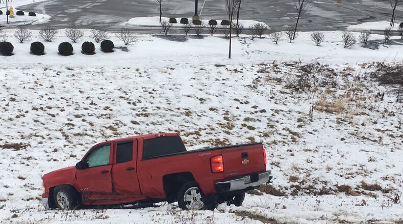 Icy conditions caused this accident, one of many in the Dayton area on Monday, Jan. 8. CHUCK HAMLIN/STAFF
