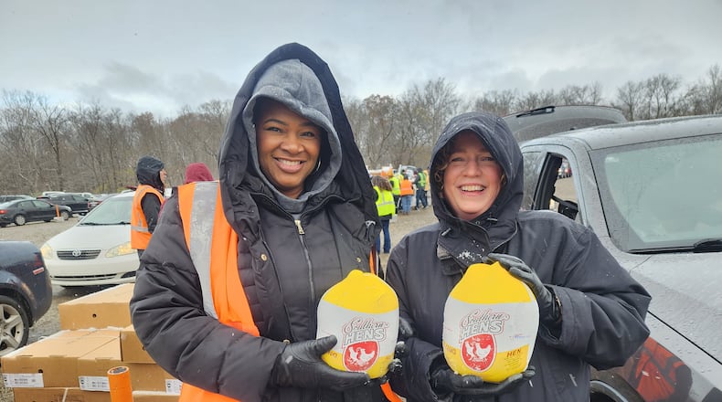 Volunteers help at events such as drive-thru distributions, conducted by The Foodbank Inc. CONTRIBUTED