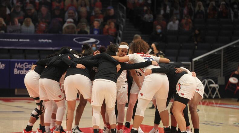 Dayton players huddle before a game against Duquesne on Sunday, Jan. 3, 2020, at UD Arena. David Jablonski/Staff