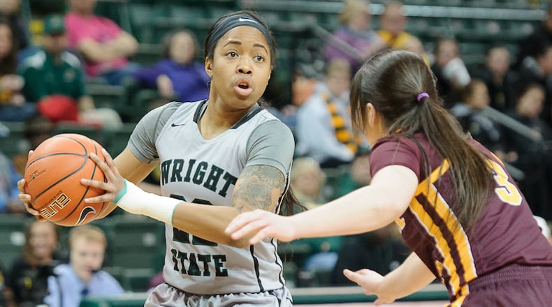 Wright State junior guard Chelsea Welch looks to pass with pressure from Central Michigan’s Presley Hudson during a WNIT game on Thursday, March 16, 2017 at the Nutter Center. Contributed Photo by Bryant Billing