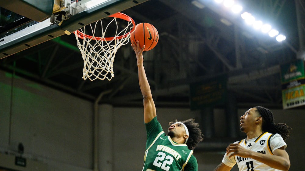 Wright State University's TJ Burch drives past Northern Kentucky University's Tae Dozier during their game on Saturday, Jan. 24, 2026. JEREMY MILLER / CONTRIBUTED PHOTO