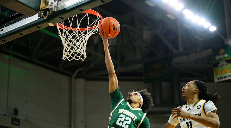 Wright State University's TJ Burch drives past Northern Kentucky University's Tae Dozier during their game on Saturday, Jan. 24, 2026. JEREMY MILLER / CONTRIBUTED PHOTO