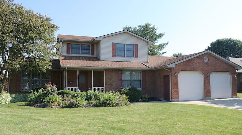 The brick 2-story has about 2,770 sq. ft. of living space. Located within the north end of Arcanum, the 4-bedroom house sits well off the road with a concrete driveway, covered front porch. The home has a tandem 4-car garage with two 2-car bays. CONTRIBUTED PHOTO BY KATHY TYLER
