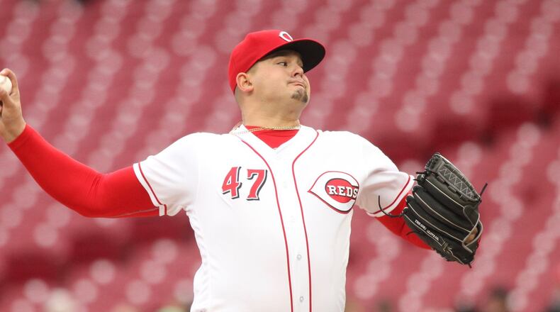 Reds starter Sal Romano pitches against the Braves on Monday, April 23, 2018, at Great American Ball Park in Cincinnati. David Jablonski/Staff