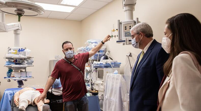 DoD DNA Operations Director, Dr. Timothy McMahon (center) and Defense POW/MIA Accounting Agency (DPAA) External Family Relations Specialist Kristina Schmidt received a brief from an Orlando Veterans Affairs Medical Center representative in this February 2023 photo. VA photo