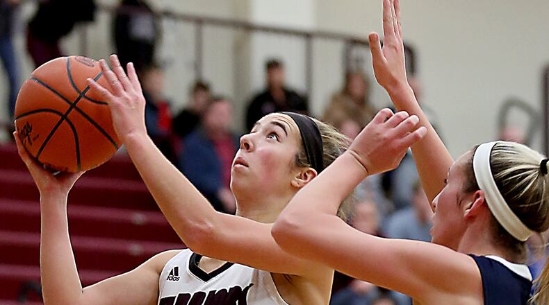 Lebanon guard Alex Warning shoots while being covered by Edgewood guard Lauren Gerber during their game at Lebanon on Dec. 19, 2016. CONTRIBUTED PHOTO BY E.L. HUBBARD