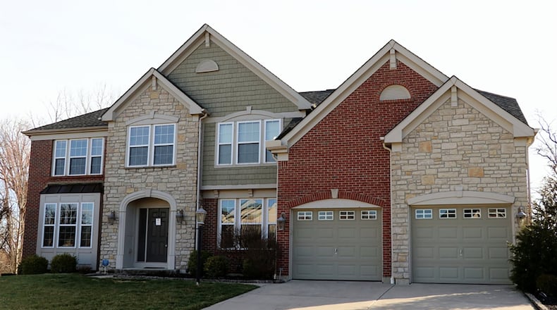 The 2-story has about 4,400 sq. ft. of living space, including the lower level. The brick-and-stone house is located within the Woodburn Farms of Washington Twp. and includes 5 bedrooms and 2-car garage. CONTRIBUTED PHOTOS BY KATHY TYLER