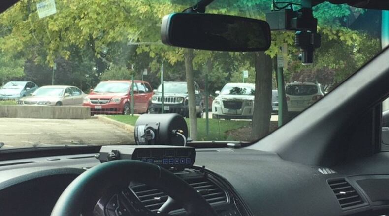 Kettering Police Departments three-camera dash cam set up. Two front-facing cameras will capture footage whenever the officer turns on their lights while a rear-facing camera records the detainee. Wednesday Oct. 5, 2016. TREMAYNE HOGUE/STAFF