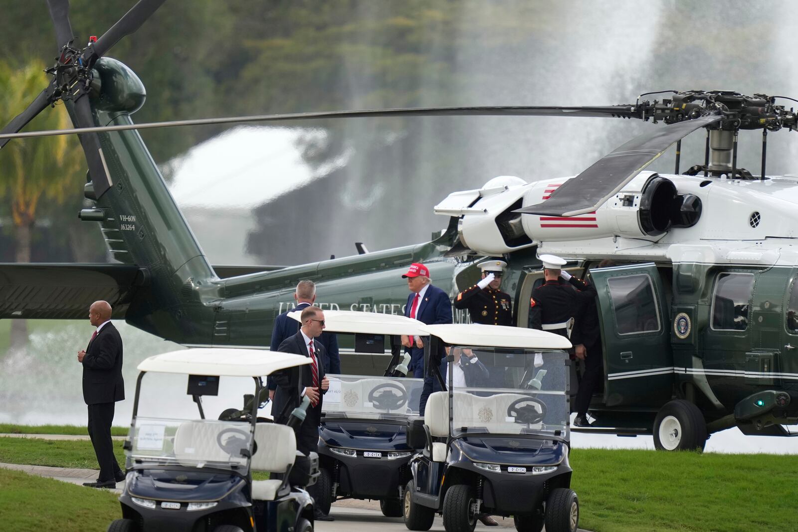 President Donald Trump steps off Marine One as he arrives at Trump National Doral during the LIV Golf Miami tournament, Thursday, April 3, 2025, in Miami. (AP Photo/Alex Brandon)
