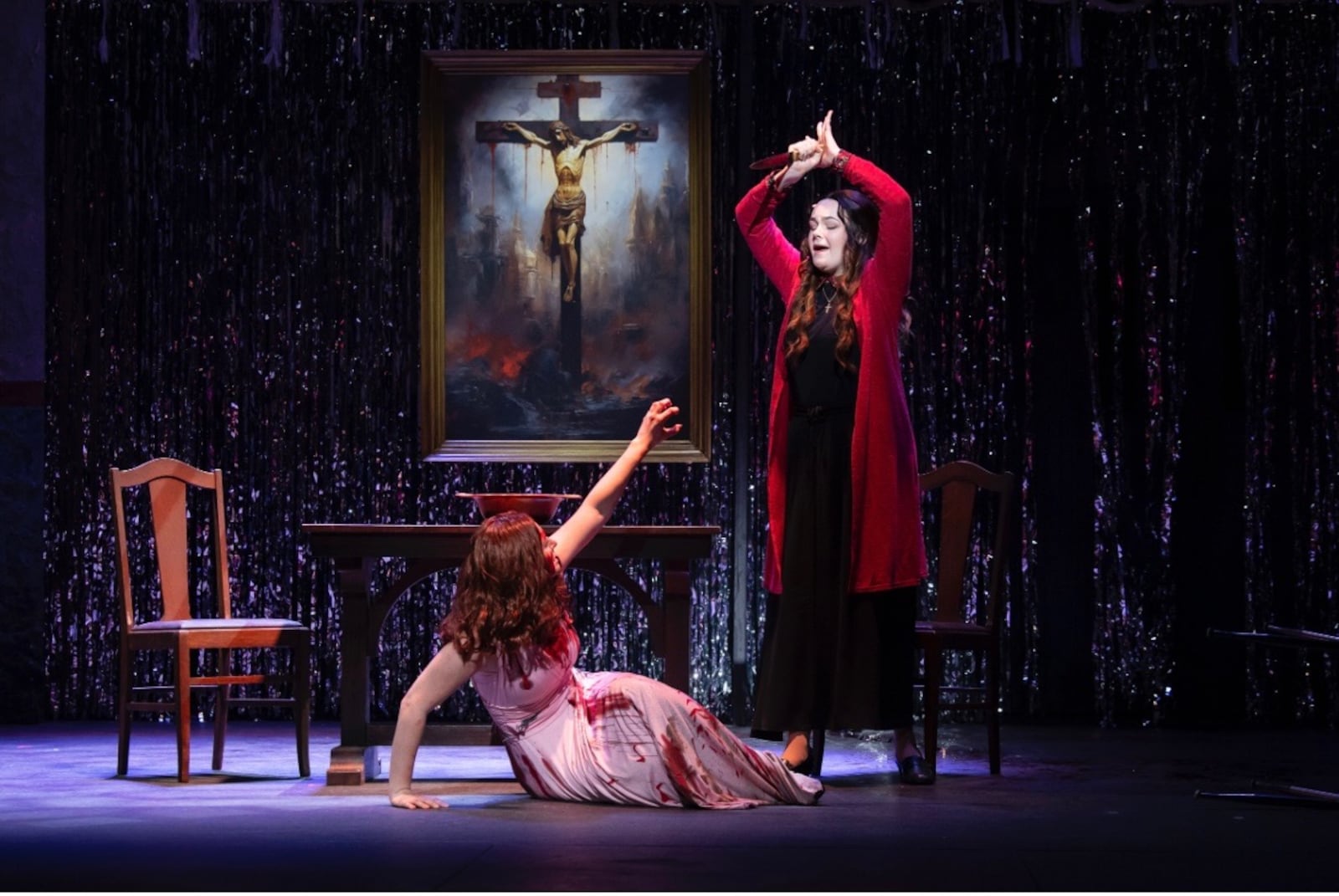 Juliette Trumbull (standing as Margaret White) and Claire Northcut (Carrie) in Wright State University's production of "Carrie: The Musical." Photo courtesy of Wright State Theatre