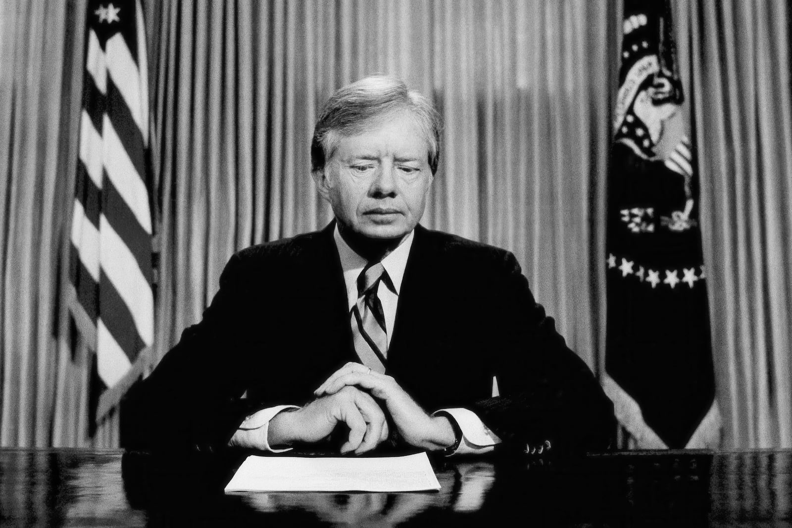 FILE - President Jimmy Carter prepares to make a national television address from the Oval Office at the White House, April 25, 1980, in Washington, on the failed mission to rescue the Iran hostages. (AP Photo, File)