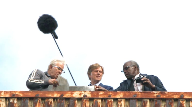 Scenes for the movie, "'Old Man and the Gun," were filmed in downtown Dayton Monday. The movie stars Robert Redford (center) and Danny Glover (right) as well as Casey Affleck and Sissy Spacek. Filming will continue in multiple locations Tuesday including the historic Liberty Savings Bank building on West Second Street. LISA POWELL / STAFF
