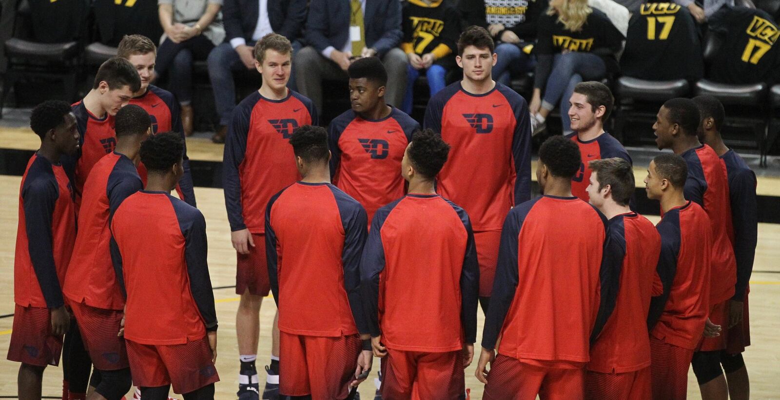 Dayton players huddle before a game against Virginia Commonwealth on Friday, Jan. 27, 2017, at UD Arena. David Jablonski/Staff