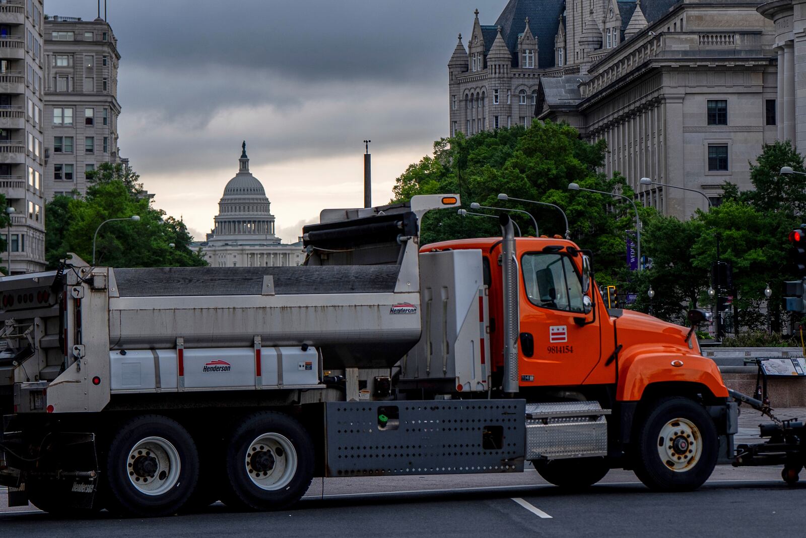 The U.S. Capitol is seen as dump trucks block an intersection ahead of an upcoming military parade commemorating the Army's 250th anniversary and coinciding with President Donald Trump's 79th birthday, Saturday, June 14, 2025, in Washington (AP Photo/Julia Demaree Nikhinson)