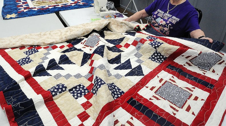 Sarah Shell works on one of her quilts Thursday, Aug. 17, 2023 for Quilts of Valor at the Englewood Earl Heck Community Center. Shell is part of a group of volunteers who sew quilts for veterans. MARSHALL GORBY\STAFF