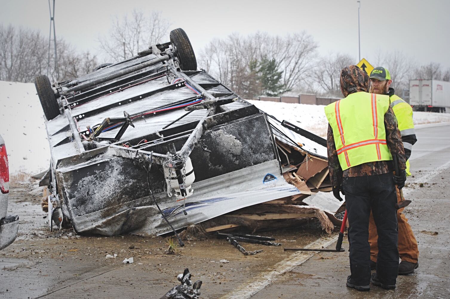 I-70 west ramp closes after trailer rolls over due to slick roads
