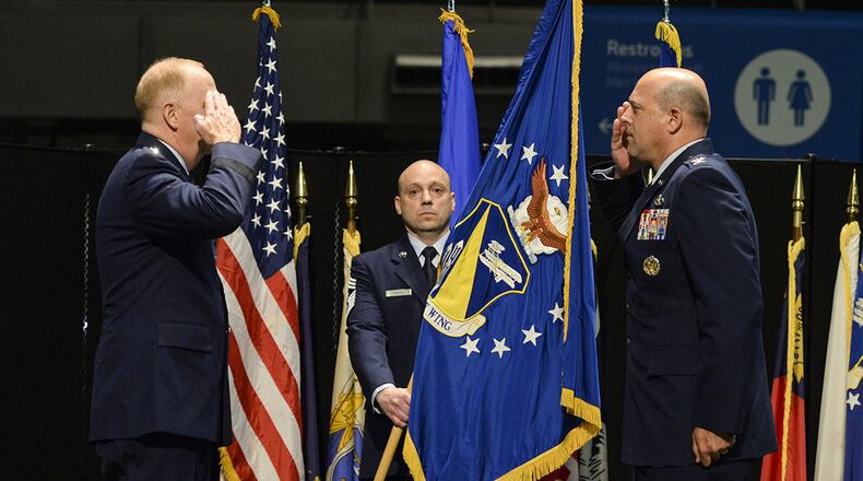 Col. Patrick Miller assumes command of the 88th Air Base Wing from Lt. Gen. Robert McMurry, Air Force Life Cycle Management Center commander, during a change of command ceremony inside the National Museum of the United States Air Force at Wright-Patterson Air Force Base June 12. Miller replaced Col. Thomas Sherman. This year’s change of command ceremony was different from years past with no more than 50 people in attendance but instead broadcast live over social media and no contact between principles due to the COVID-19 pandemic. (U.S. Air Force photo/Wesley Farnsworth)
