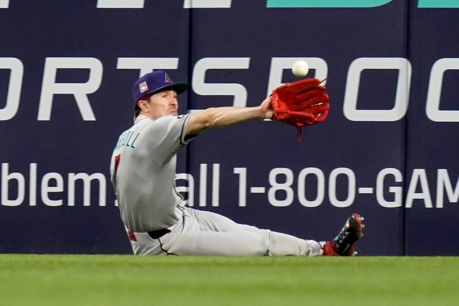 Arizona Diamondbacks center fielder Corbin Carroll catches a fly ball hit by Pittsburgh Pirates' Ke'Bryan Hayes during the fourth inning of a baseball game Saturday, July 26, 2025, in Pittsburgh. (AP Photo/Matt Freed)