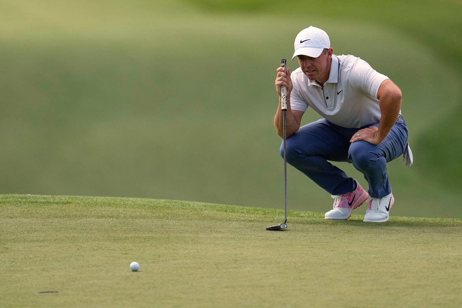 Rory McIlroy, of Northern Ireland, lines up a putt on the seventh hole during the third round at the Masters golf tournament, Saturday, April 12, 2025, in Augusta, Ga. (AP Photo/David J. Phillip)
