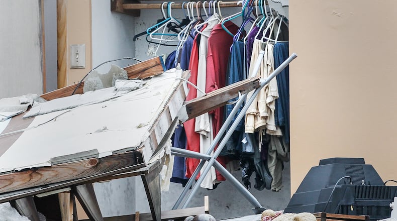 Three months after the Memorial Day tornadoes, little progress has been made on some houses like those in Trotwood on Greenbrook Drive seen Tuesday, Aug. 27, 2019. CHRIS STEWART / STAFF