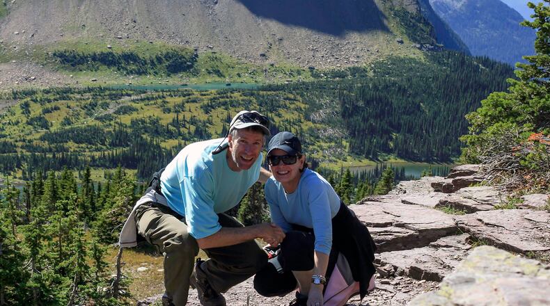 Scott Arentsen (L) and his wife, Candace Holthouse, love to travel and now that they are retired, have increased their travelling to between five and six trips annually. Here they are visiting Glacier National Park in 1986 on their honeymoon. CONTRIBUTED