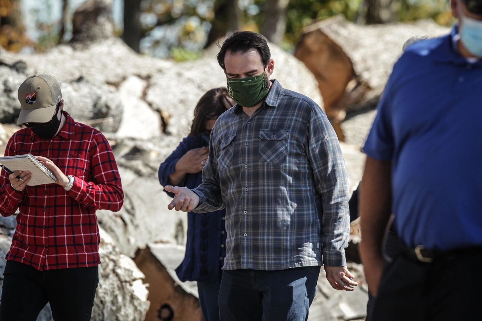 Grady McGahan, founder and executive director of Retreet, a disaster relief organization, tour Sinclair Park in Harrison Twp. Along with other Miami Valley location hit hard by the Memorial Day tornado in 2019. JIM NOELKER / STAFF