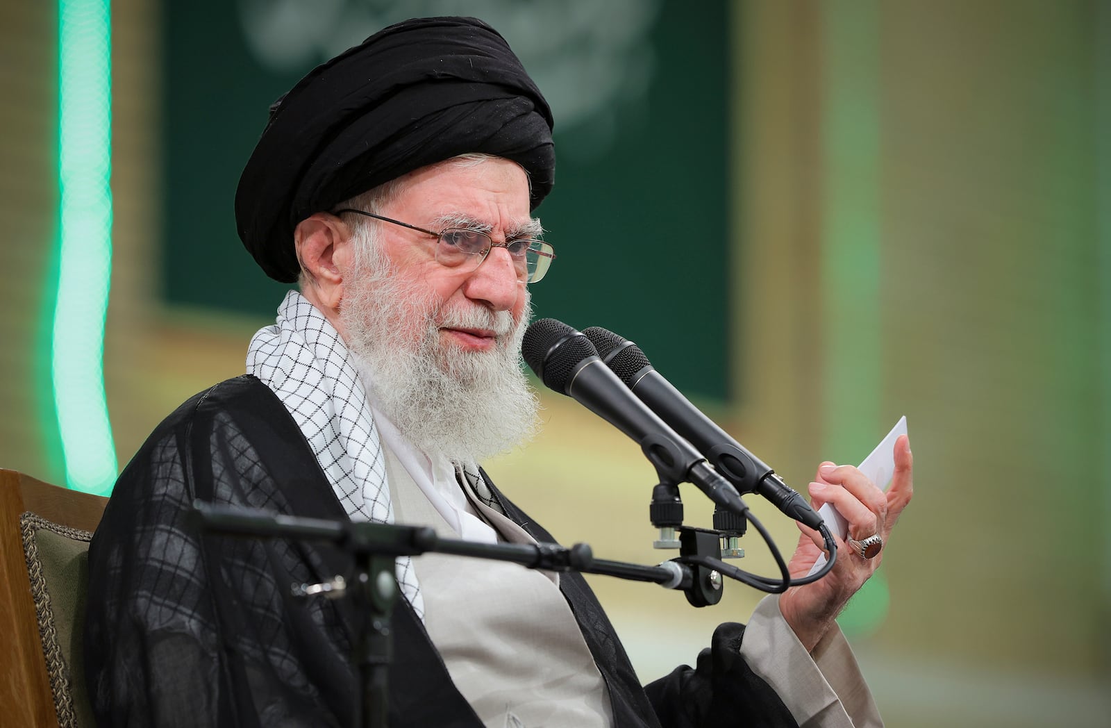 In this photo released by an official website of the office of the Iranian supreme leader, Supreme Leader Ayatollah Ali Khamenei speaks during a meeting with teachers, in Tehran, Iran, Saturday, May 17, 2025. (Office of the Iranian Supreme Leader via AP)