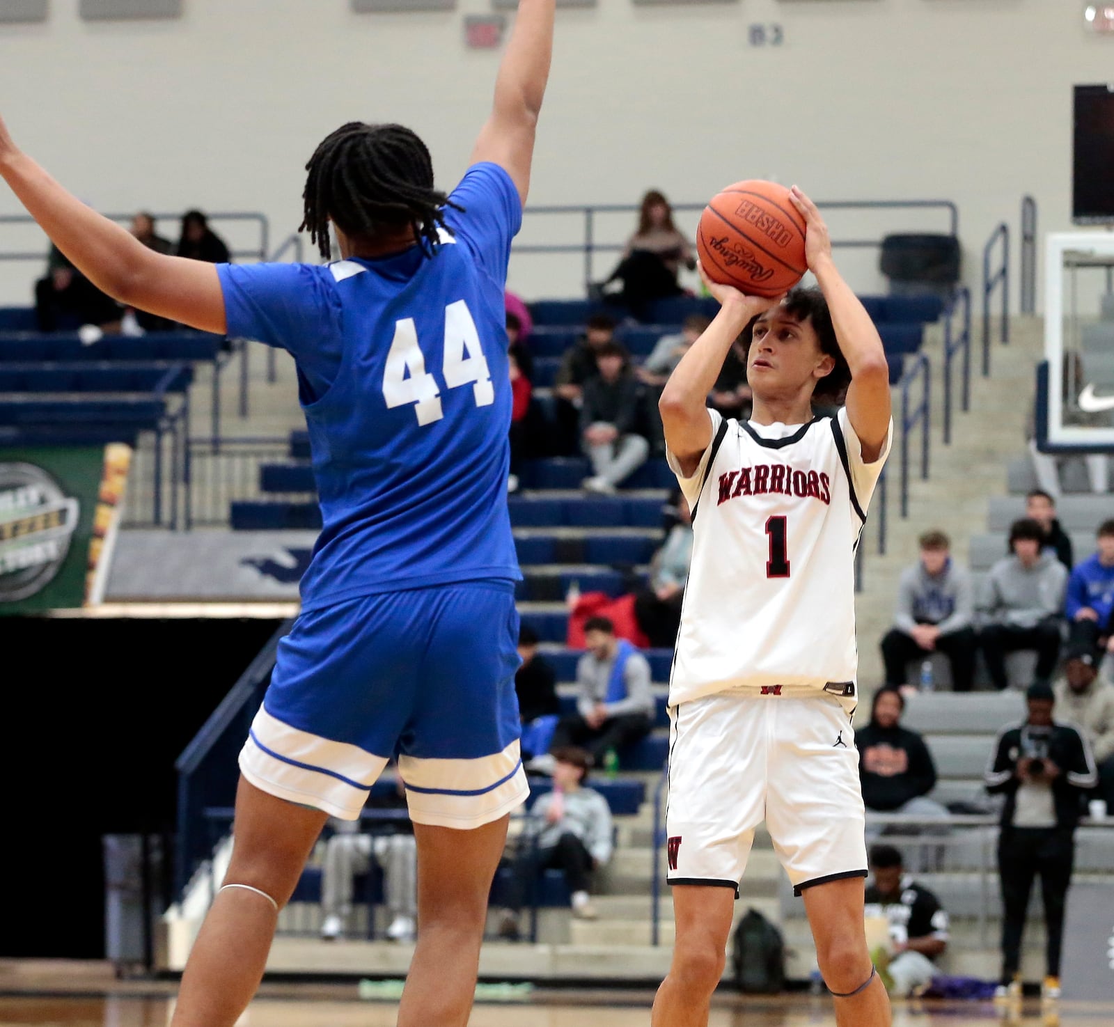 Wayne senior Kaden Post puts up a shot over Wyoming's Carlyle Billingsley. Wyoming defeated Wayne 60-49 at the 2026 The Beacon Orthopaedics Flyin' to the Hoop showcase at Trent Arena in Kettering. STEVEN WRIGHT / STAFF