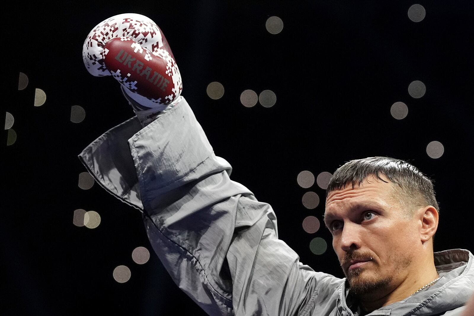Ukraine's Oleksandr Usyk acknowledges spectators as he walks out for his world heavyweight boxing title fight against Britain's Daniel Dubois, in London, Saturday, July 19, 2025. (Bradley Collyer/PA via AP)
