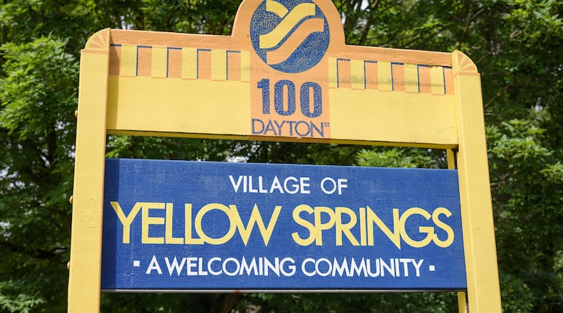A sign outside the village limits welcoming visitors to Yellow Springs. TOM GILLIAM / CONTRIBUTING PHOTOGRAPHER