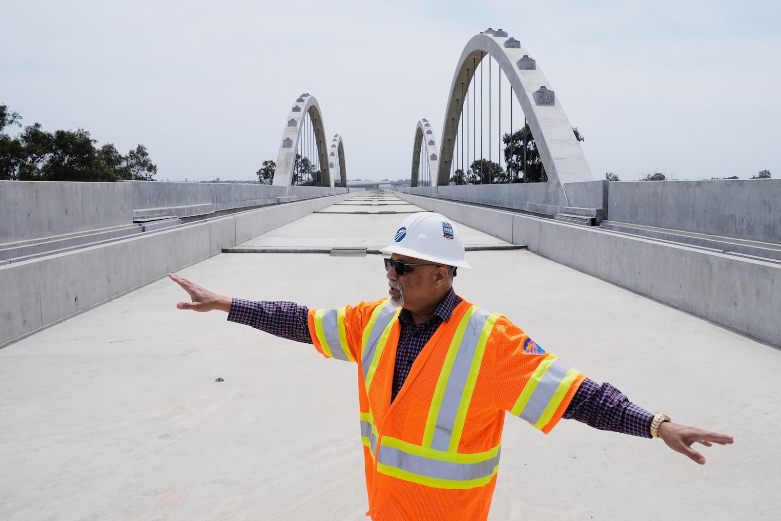 Garth Fernandez, Central Valley regional director for the California High-Speed Rail Authority, talks about the Cedar Viaduct, Tuesday, April 15, 2025, in Fresno, Calif. (AP Photo/Godofredo A. Vásquez)