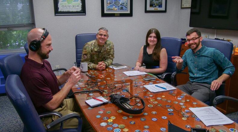 Maj. Gen. William Cooley, Air Force Research Laboratory commander, participates in a ‘Lab Life’ podcast with Michele Miller and Kenneth McNulty, Lab Life podcasts hosts, while being recorded by Chris Decker, 88th Audiovisual Production specialist. Cooley spoke about several areas of interest to AFRL, ranging from biology and human genetics, materials science, high energy laser systems, global positioning systems, space vehicles and low-cost attritable aircraft. (U.S. Air Force photo)