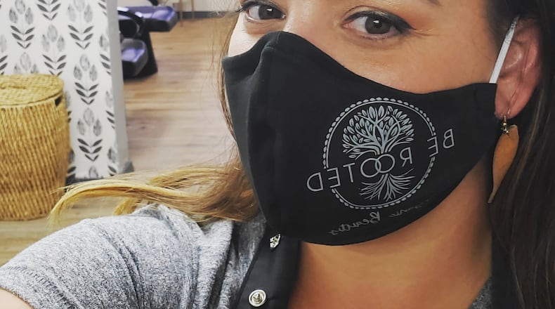 Be Rooted owner and stylist Tessa White sports a Be Rooted mask at the salon. The salon has adapted to the many changes brought on by the coronavirus pandemic. Photo courtesy of Tessa White.