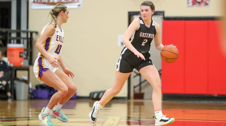 Greenon High School senior Claire Henry is guarded by Eaton's Lily Shepherd during their first round tournament game on Wednesday, Feb. 8 at Tecumseh High School in New Carlisle. The Knights won 72-64 in overtime. Michael Cooper/CONTRIBUTED